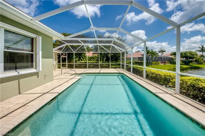 Outdoor pool featuring a patio area and a lanai