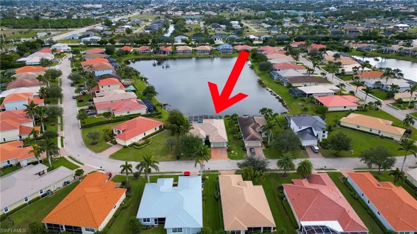 Aerial perspective of suburban area with a large body of water