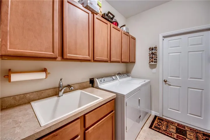 Laundry area with washing machine and dryer and cabinet space