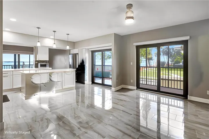 Sliders with balconies in every room throughout the condo