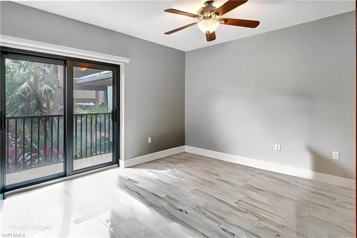 Spacious guest bedroom with walk out balcony