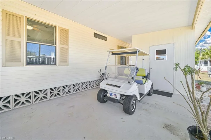 View of patio with a carport