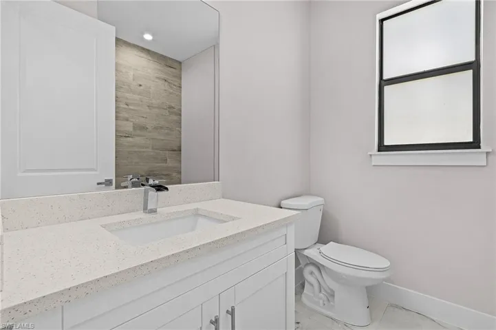 Bathroom with vanity and toilet