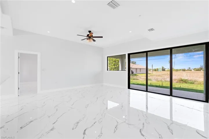 Unfurnished room with recessed lighting and a ceiling fan