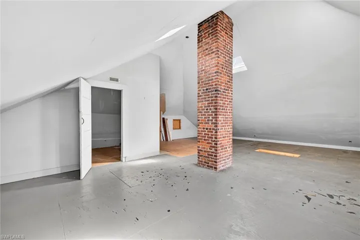 Additional living space featuring vaulted ceiling