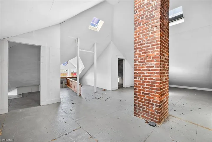 Bonus room with a skylight and lofted ceiling