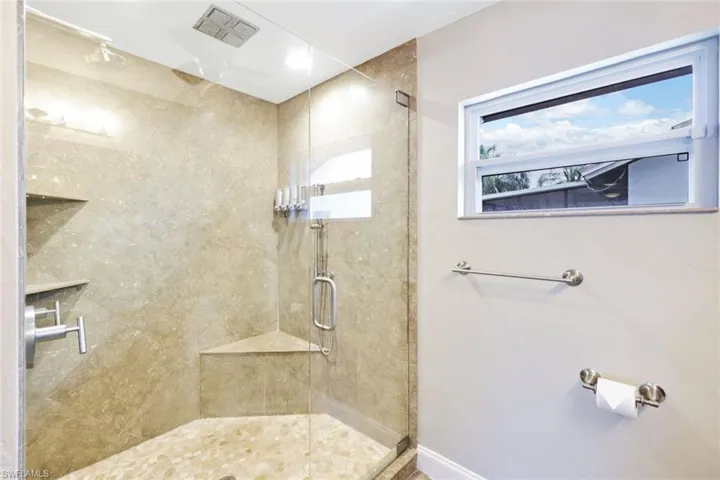 Bathroom with a shower with shower door
