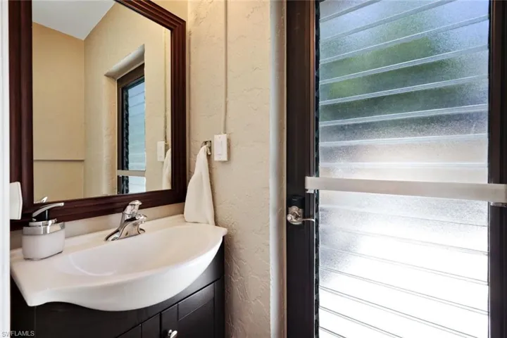 Bathroom featuring vanity and plenty of natural light