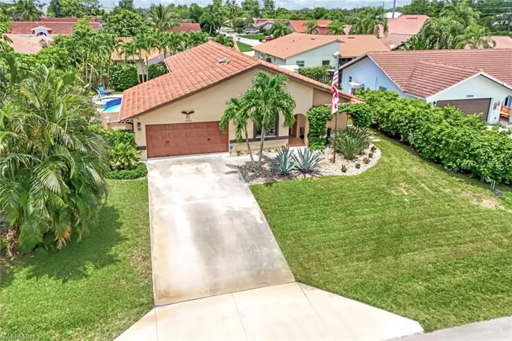 Mediterranean / spanish-style home with a front lawn