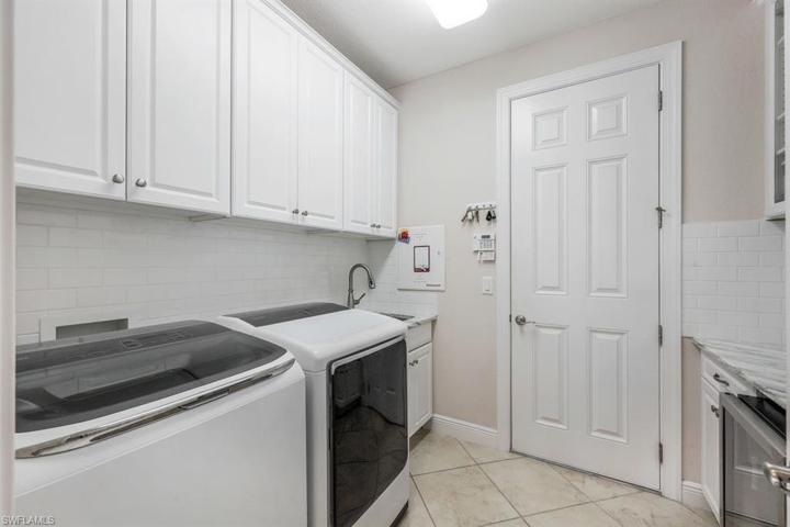 Upgraded Laundry, with garage access door