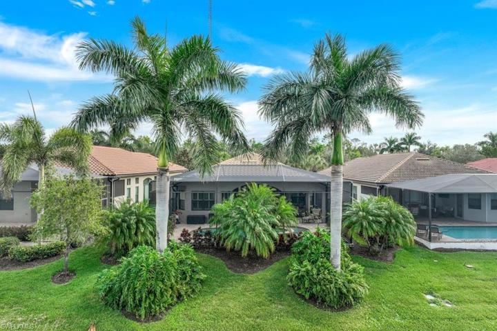 Rear view with tropical landscaping