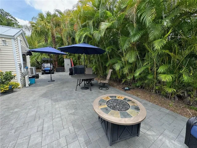 View of patio with a fire pit