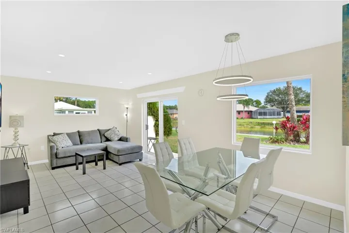 Dining room featuring light tile patterned floors and recessed lighting