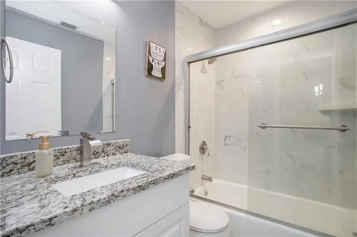 Guest bathroom between guest bedrooms