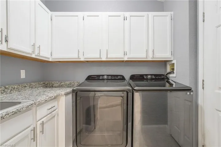 Separate spacious laundry room off the kitchen with lots of extra storage