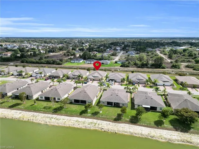 Aerial perspective of suburban area with a large body of water