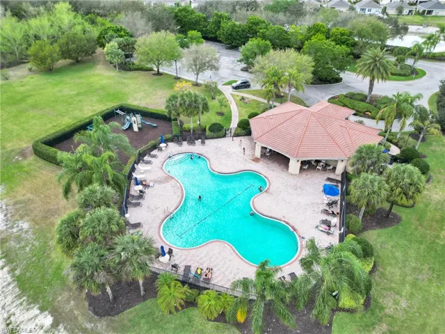 Community pool featuring a yard