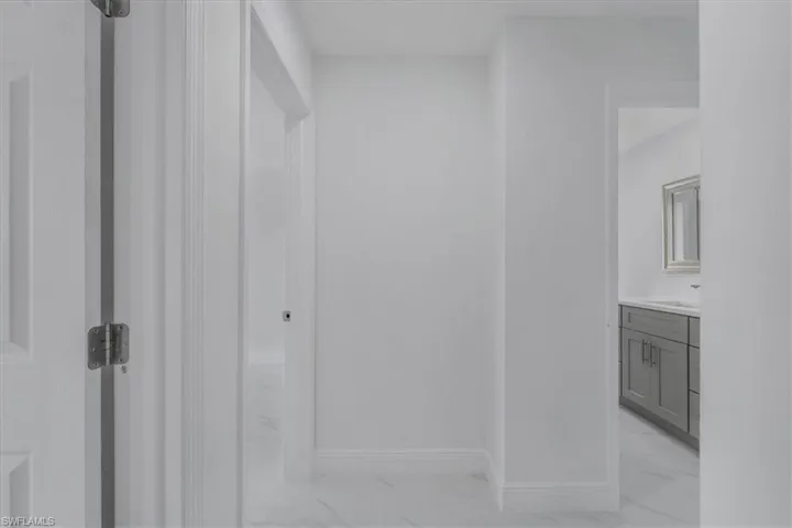 Bathroom featuring vanity and baseboards