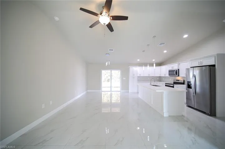 Large Living Room-Dining Area With Double Sliders That Lead Out To The Covered Lanai!