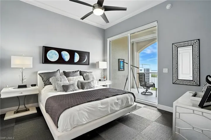Bedroom featuring ornamental molding, a ceiling fan, and access to exterior - Virtually Edited Image