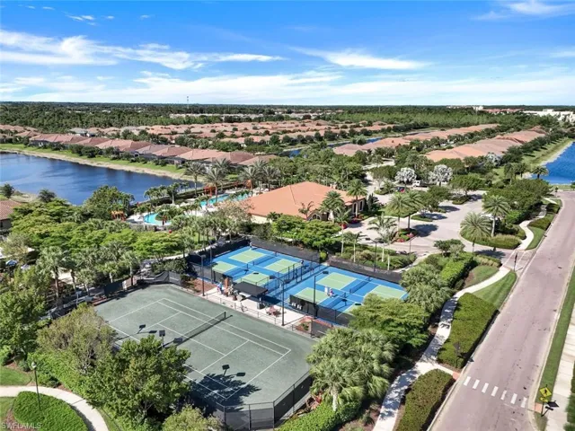 Birds eye view of property with a residential view and a water view