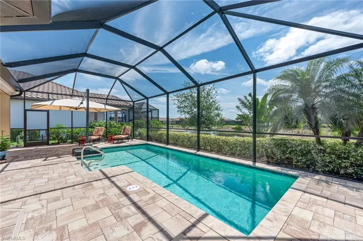 Pool featuring a lanai and a patio