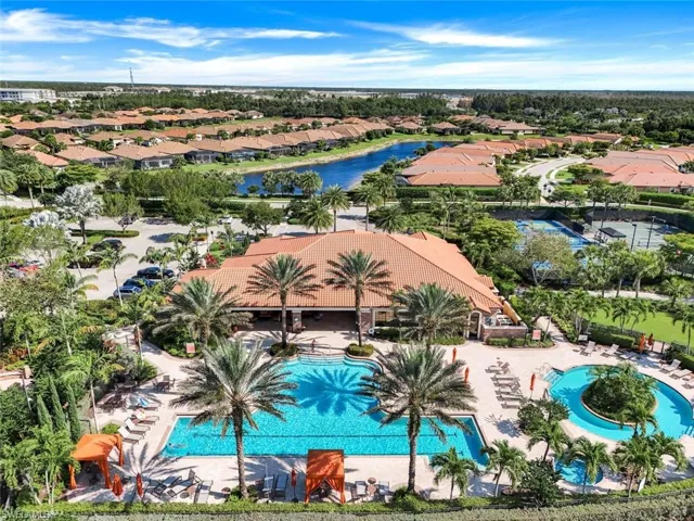 Aerial view featuring a water view and a residential view