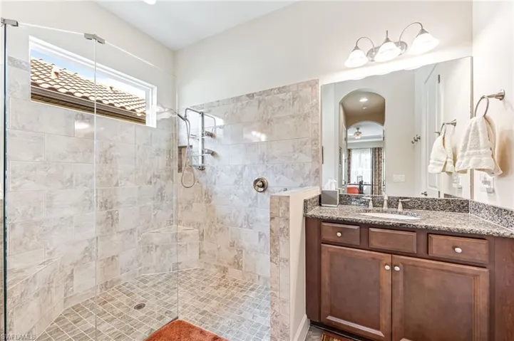 Bathroom with walk in shower and vanity