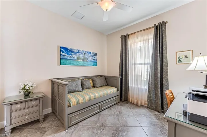 Sitting room featuring baseboards, a ceiling fan, and visible vents