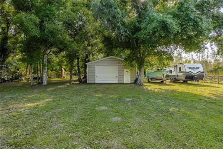 24X24 metal building, lofted and poured concrete floors. Two roll up doors. This ample property allows for covered storage as well as plenty of open air storage, AND there is still room for Livestock!