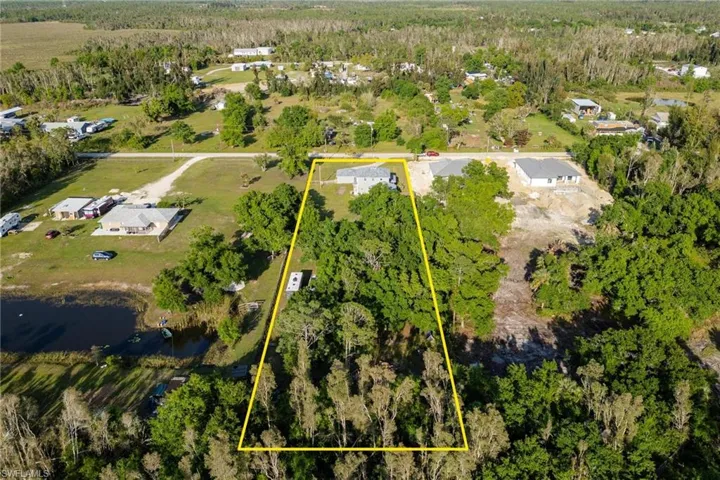 Property view looking toward Aralia Dr.