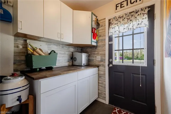 Butler's pantry/ mud room with exterior door to side porch exit.