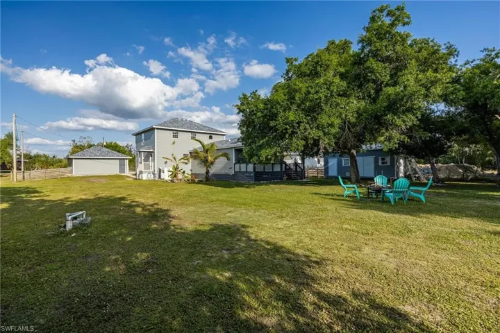 Rear view of the home and detached garage.