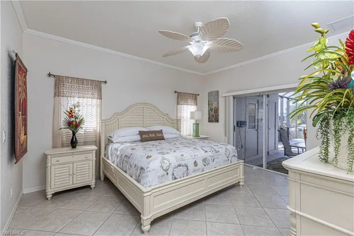 The owners retreat with additional sliders leaves you gazing out at the lanai and water views right from your bed!!