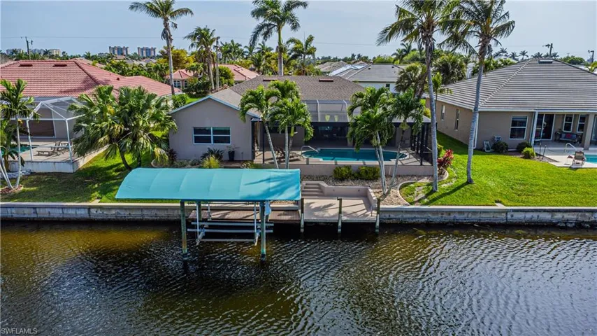 7000 lb. boat lift with composite dock has a brand new canopy to protect your boat!