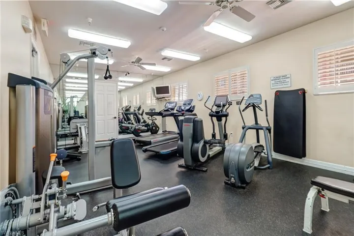 Exercise room featuring ceiling fan