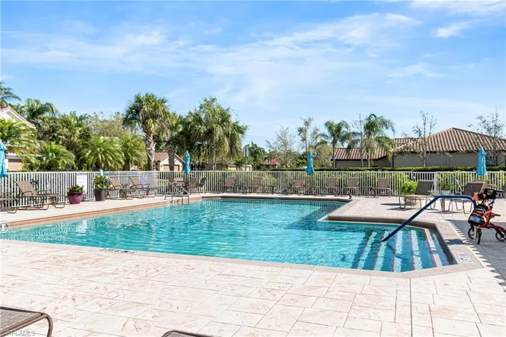 Community pool with a patio area
