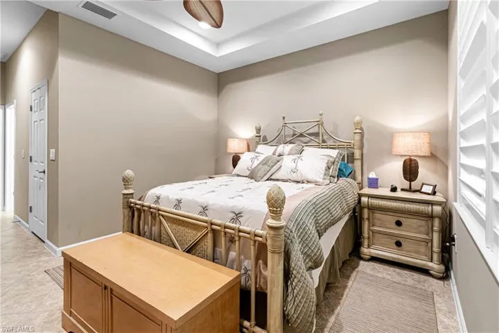 Bedroom with a tray ceiling