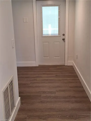 Hallway to Garage, Main Bedroom and Outdoor Pool Area