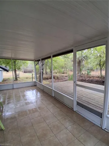 Unfurnished sunroom featuring plenty of natural light