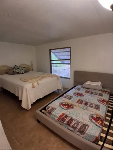 Bedroom featuring tile patterned floors