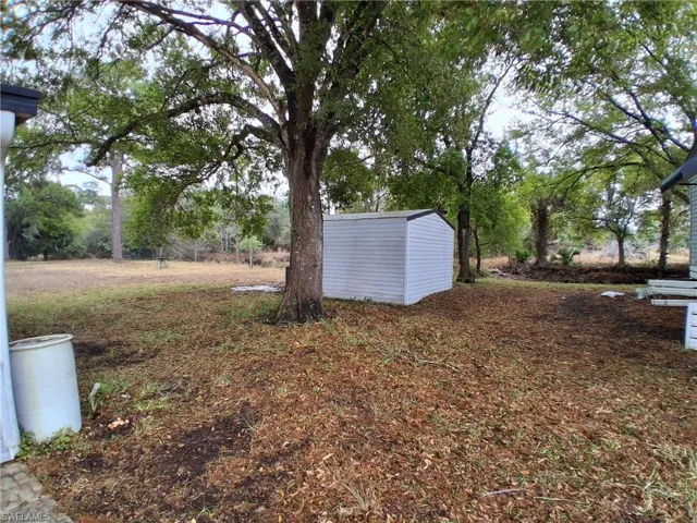 View of yard with a shed