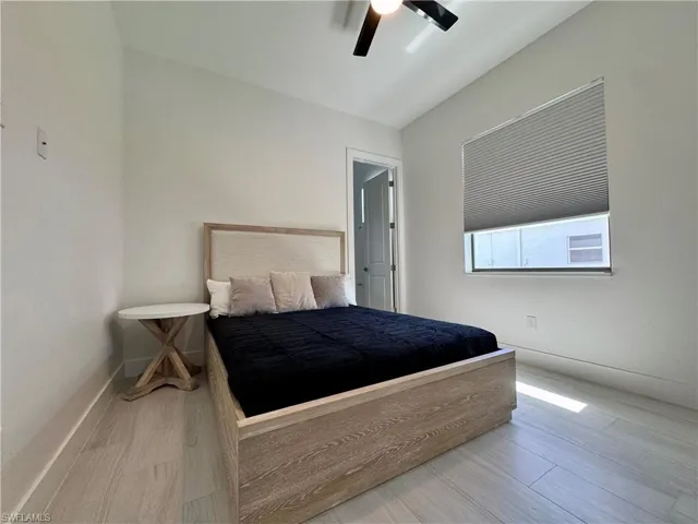 Bedroom featuring wood finished floors and ceiling fan