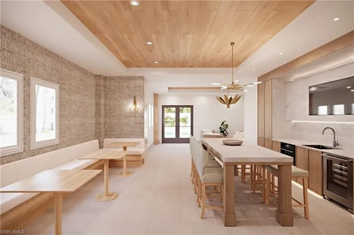 Corridor featuring light tile patterned flooring, an inviting chandelier, wooden ceiling, and a high ceiling