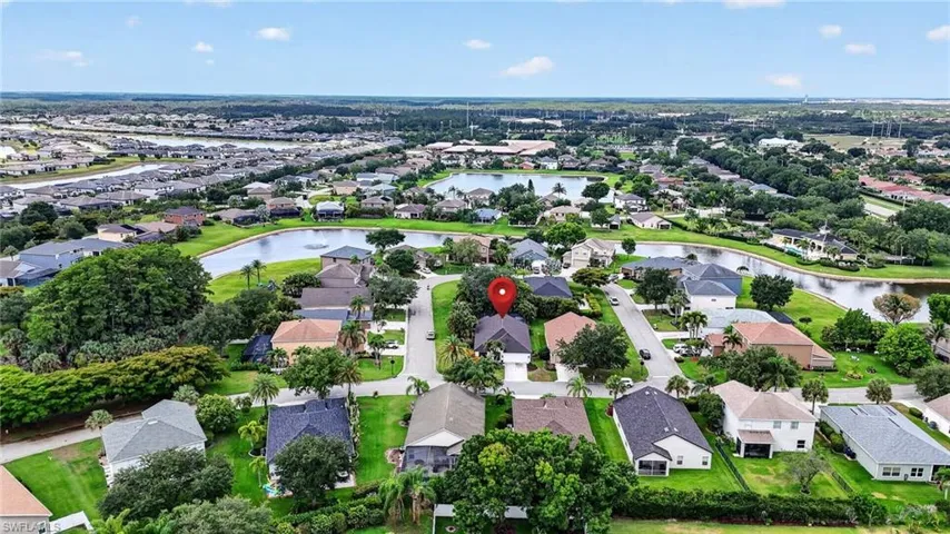 Aerial perspective showcasing a residential community with numerous homes