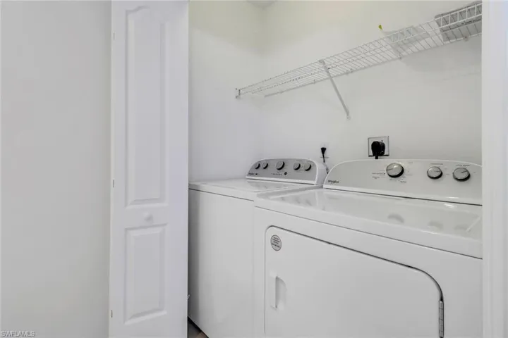 Clothes washing area featuring independent washer and dryer