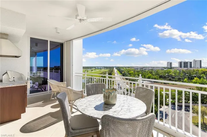 Balcony with ceiling fan, grilling area (no longer permitted, this one is grand-fathered in) and exterior kitchen