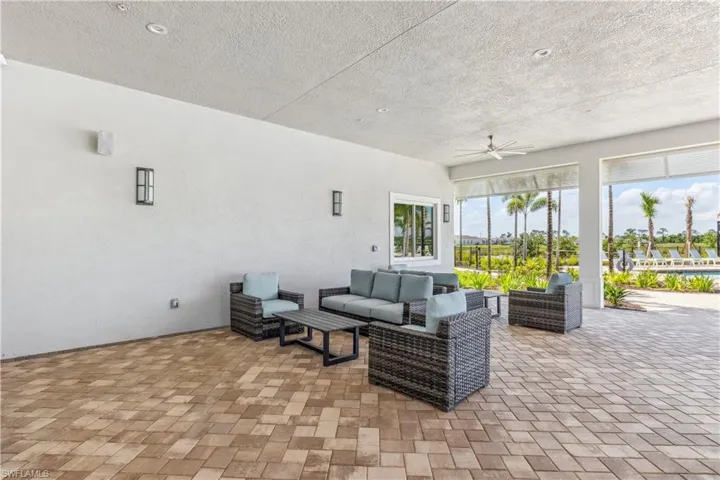 View of patio featuring outdoor lounge area and ceiling fan