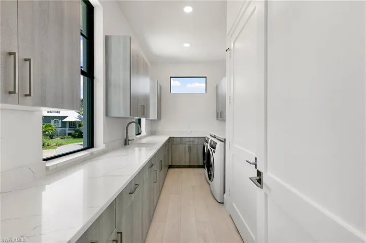 Spacious Laundry with storage & Natural Light
