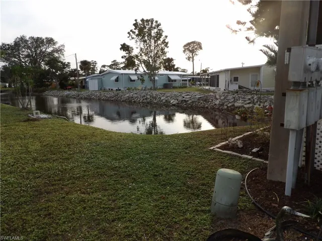 View of yard with a water view
